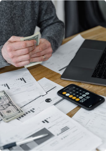 A man managing his finances at a desk