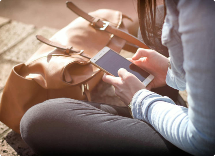 A lady using her smartphone outside